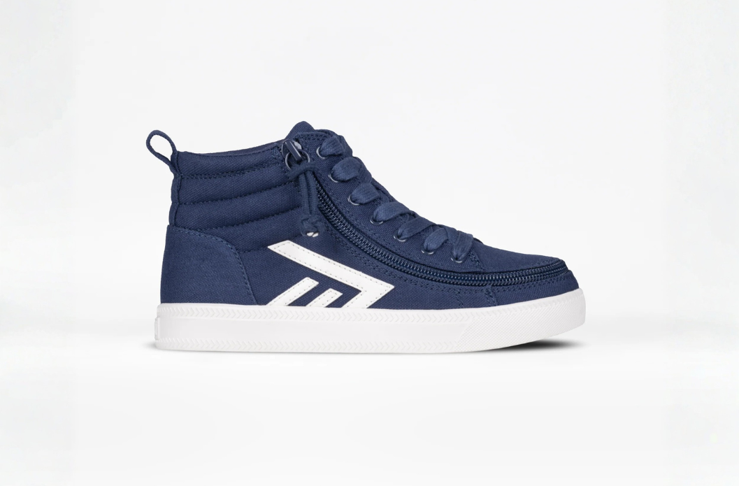Navy Billy adaptive high-top shoe with wraparound zipper for easy on and off. Shoe, laces, and zipper are all navy, the logo and the soles are white.