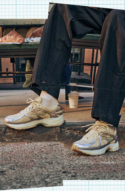 Adult sitting outside wearing Brooks running shoes, a frequently recommended option for AFO users.