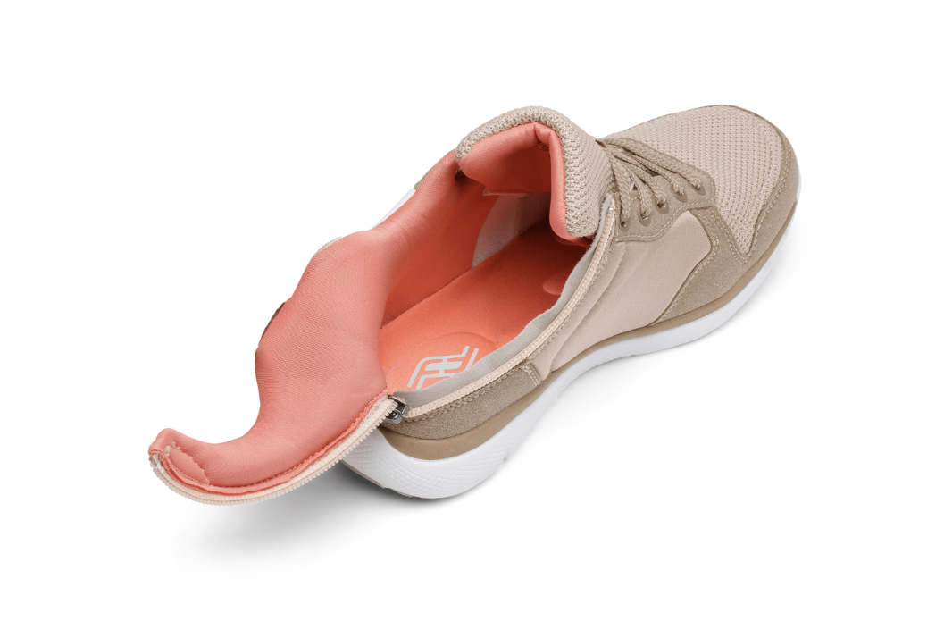 Taupe mesh sneaker with full-length side zip and open salmon-colored interior, showing wide-entry adaptive design