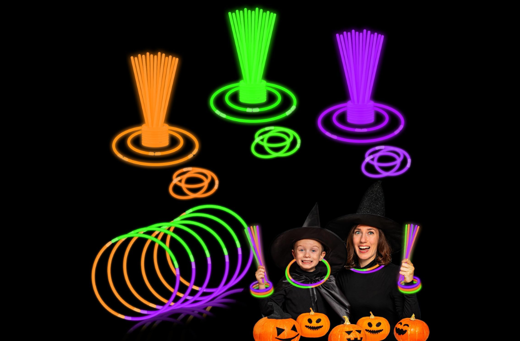 Orange, green, and purple glow-stick bracelets and necklaces with two children in Halloween costumes