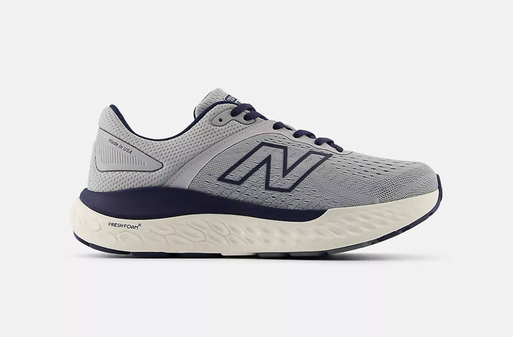 A gray New Balance Fresh Foam X 1540 v4 designed for maximum stability and orthotic support. It features a gray mesh upper, navy blue 'N' logo, and a thick cream-colored midsole.
