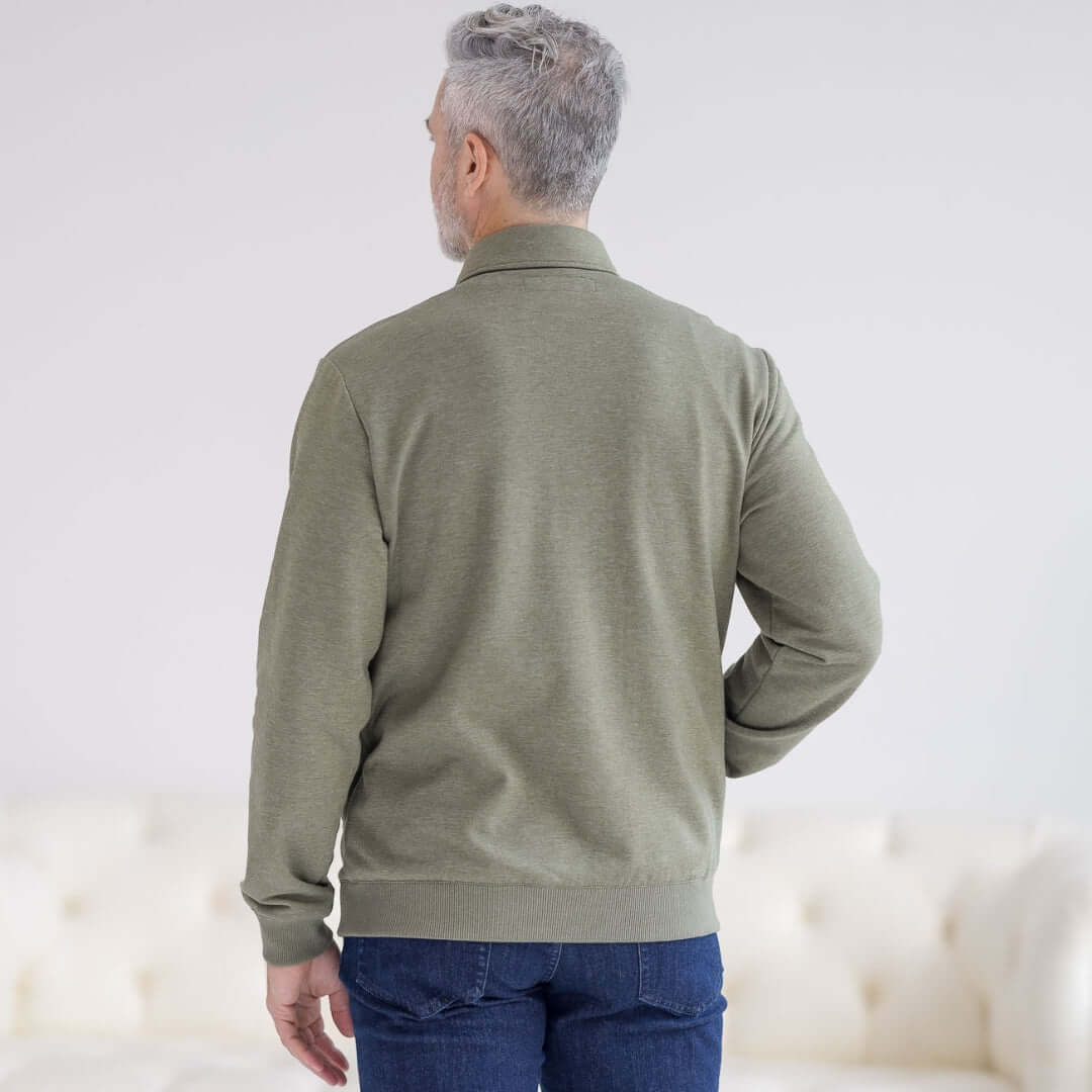 Man wearing MagnaReady heathered olive magnetic front sweatshirt and blue jeans, back view,  standing against a white background.