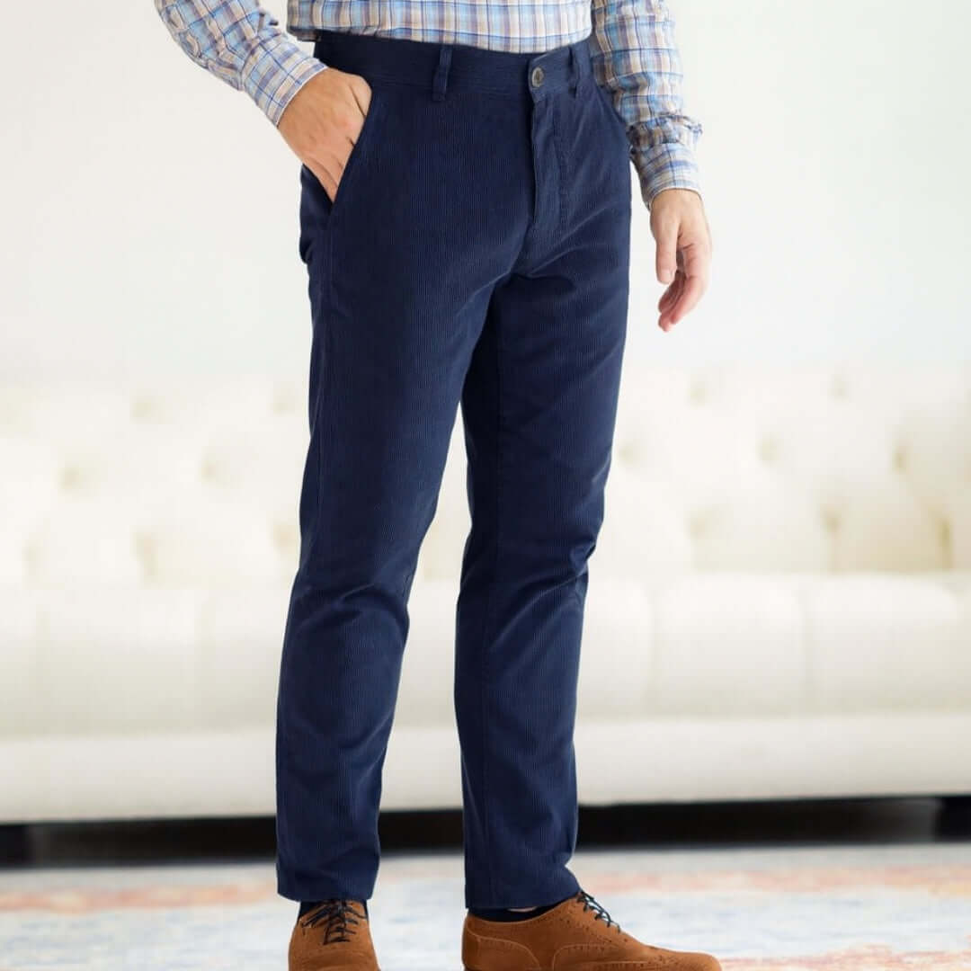 Person wearing navy MagnaReady corduroy pants with a blurred background.