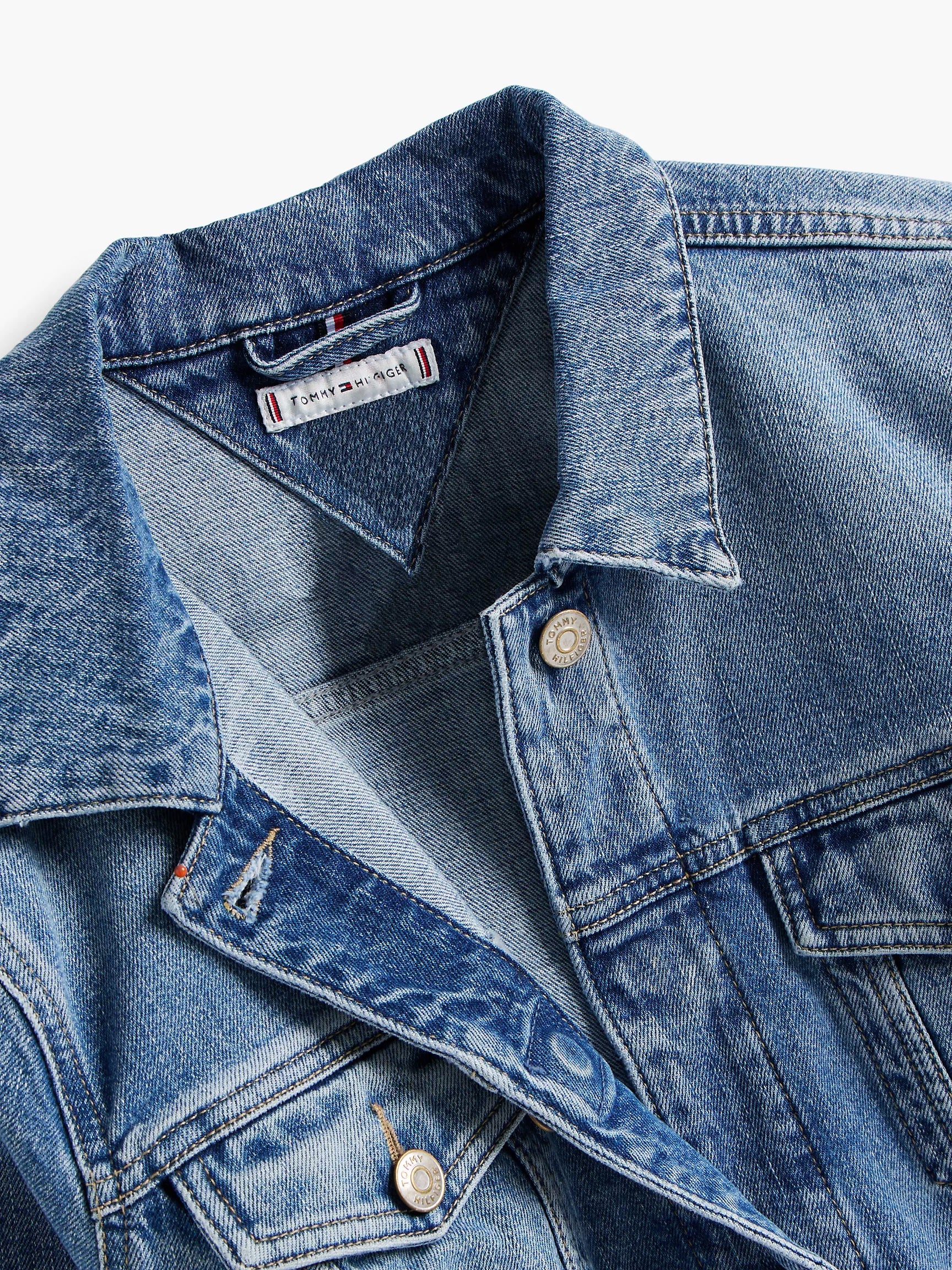 Adaptive denim shirt with hidden magnetic button closures.
