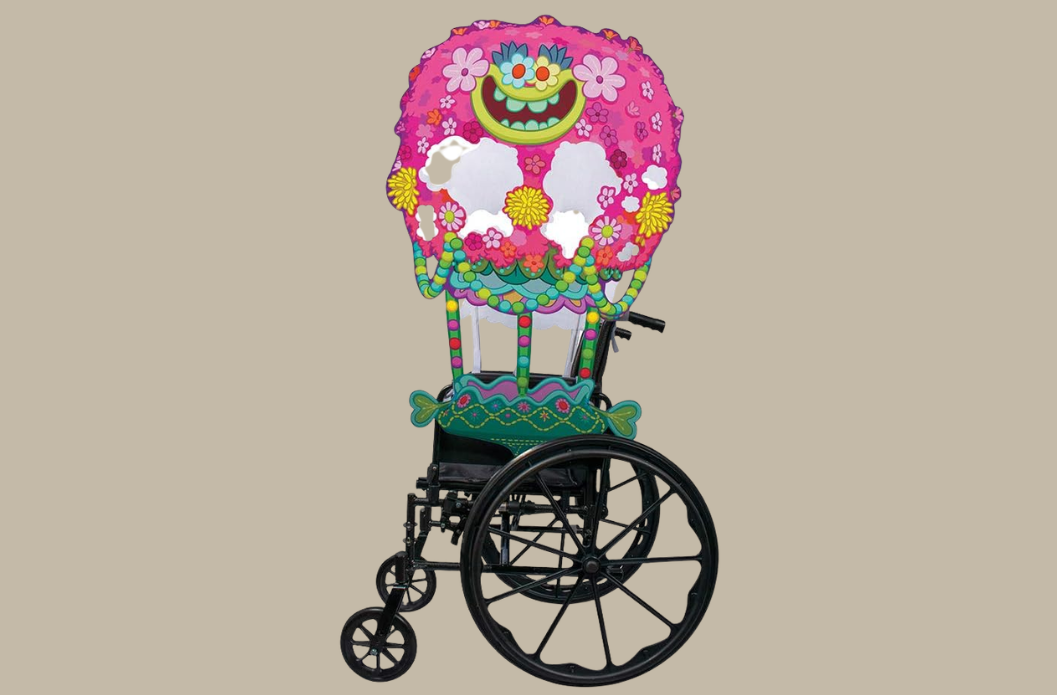 Trolls-themed wheelchair Halloween cover with colorful floral details