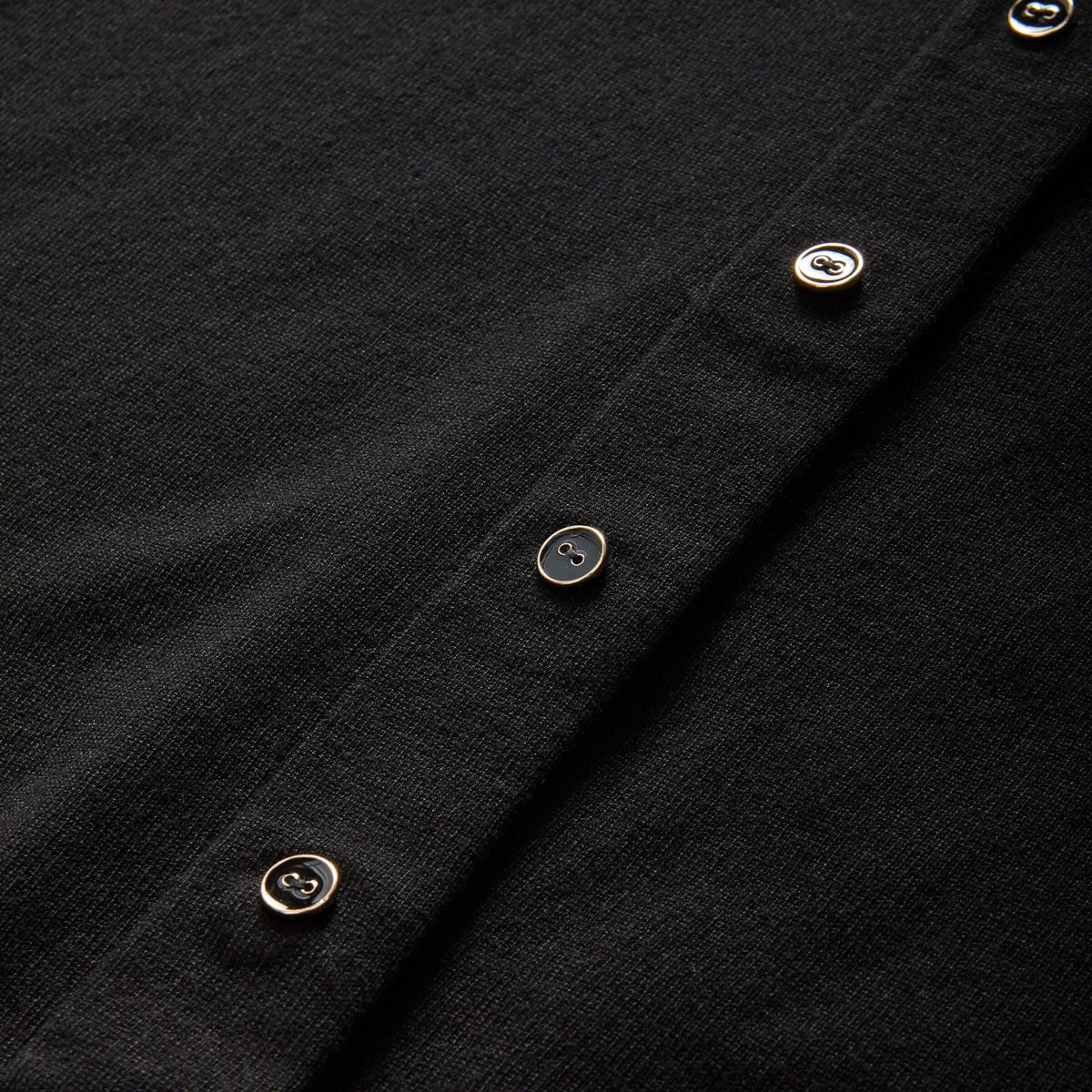 MagnaReady black cardigan magnetic front closure detail.